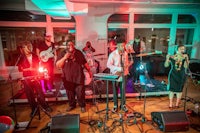 a group of people playing music in a room